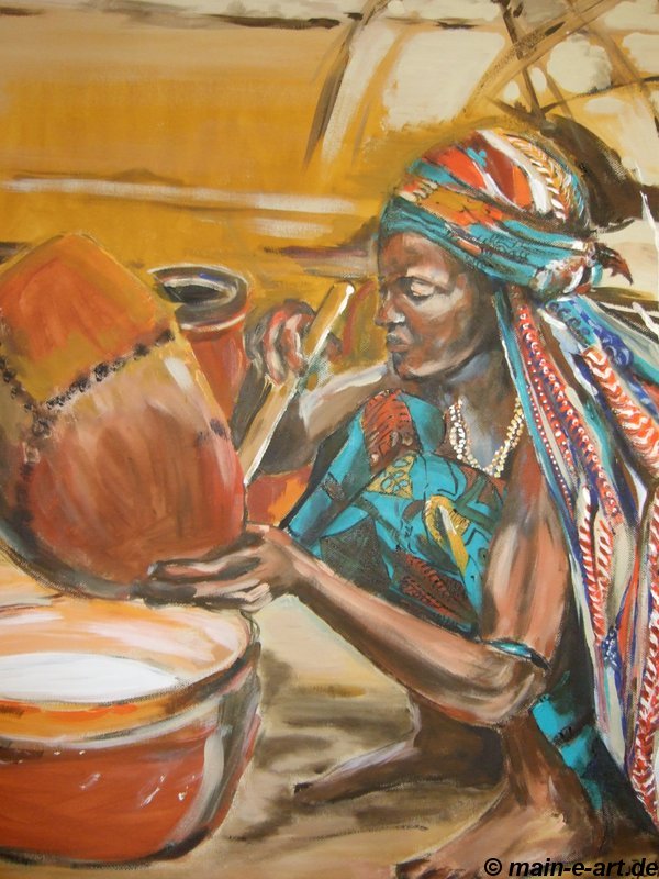 Frau im Tschad beim Buttern